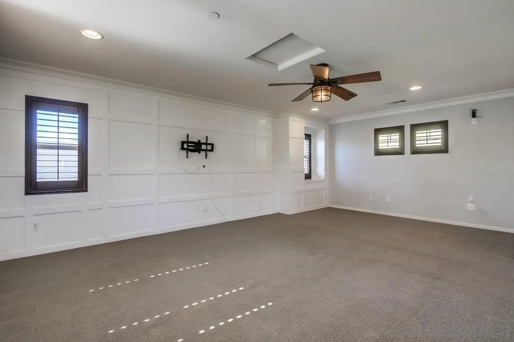 1859 Khaki Lane Chula Vista, CA 91913 - Photo 29 of 62 en empty room with windows and ceiling fan