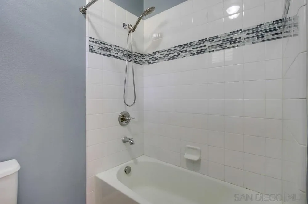 1859 Khaki Lane Chula Vista, CA 91913 - Photo 40 of 62 a bathroom with a bath tub with a shower