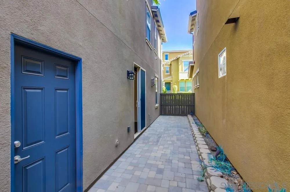 1859 Khaki Lane Chula Vista, CA 91913 - Photo 44 of 62 a view of a pathway besides a house