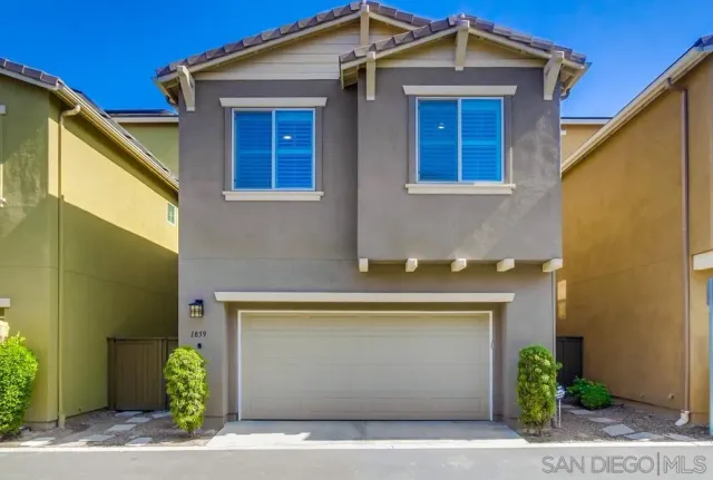 a patio with a patio table and chairs