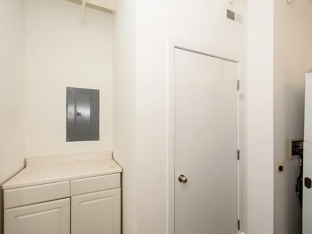 a bathroom with a shower and a sink