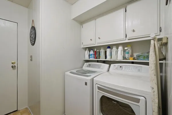 a utility room with dryer and washer
