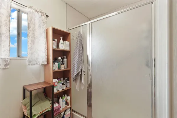 a room that has a dresser and a chair in it