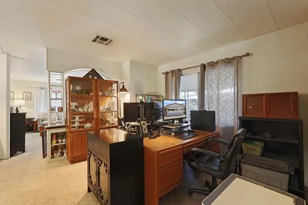 a view of a workspace with furniture