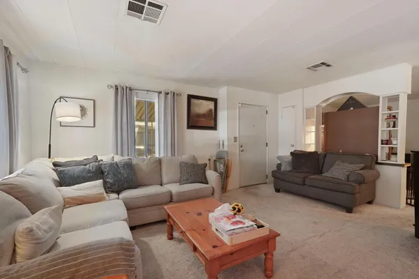 a living room with furniture and a couch