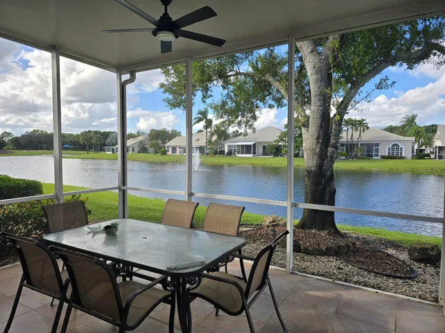 a view of an outdoor dining space with a table and chairs