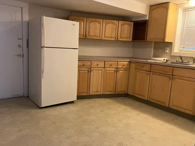 a view of a kitchen with electric appliances