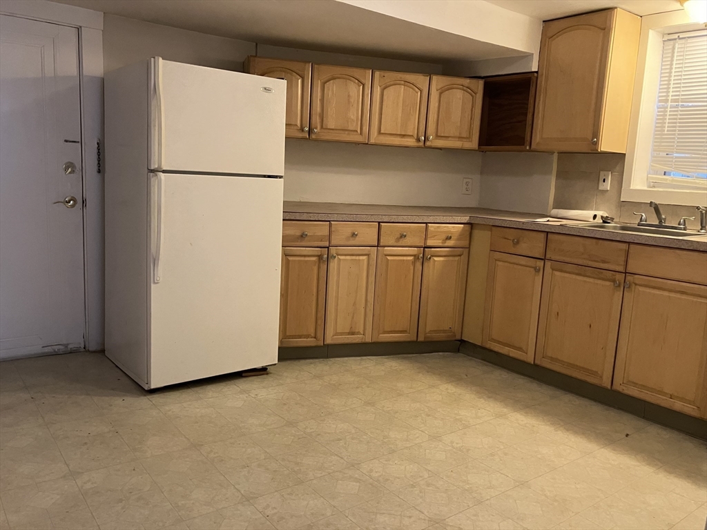 211 St Paul Street, Unit B Brookline, MA 02446 - Photo 3 of 6 a view of a kitchen with electric appliances