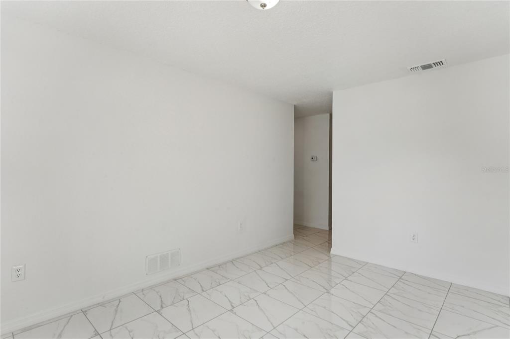 10237 Carrin Road Spring Hill, FL 34608 - Photo 13 of 39 a view of an empty room