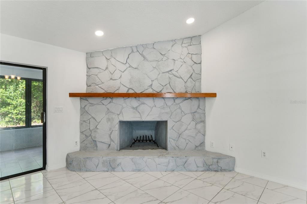 10237 Carrin Road Spring Hill, FL 34608 - Photo 7 of 39 an entryway with fireplace
