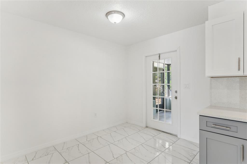 10237 Carrin Road Spring Hill, FL 34608 - Photo 10 of 39 an empty room with windows