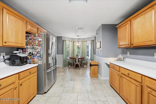 a kitchen with sink cabinets and window