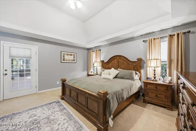 a bedroom with a bed next to a window with outer view