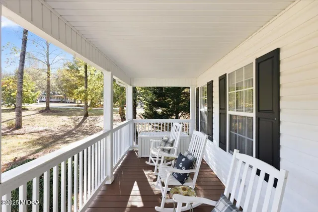 a view of porch with a furniture