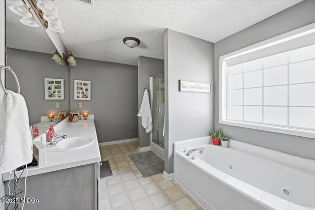 a bathroom with a tub sink and toilet