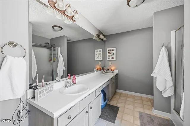 a bathroom with a sink vanity and a mirror
