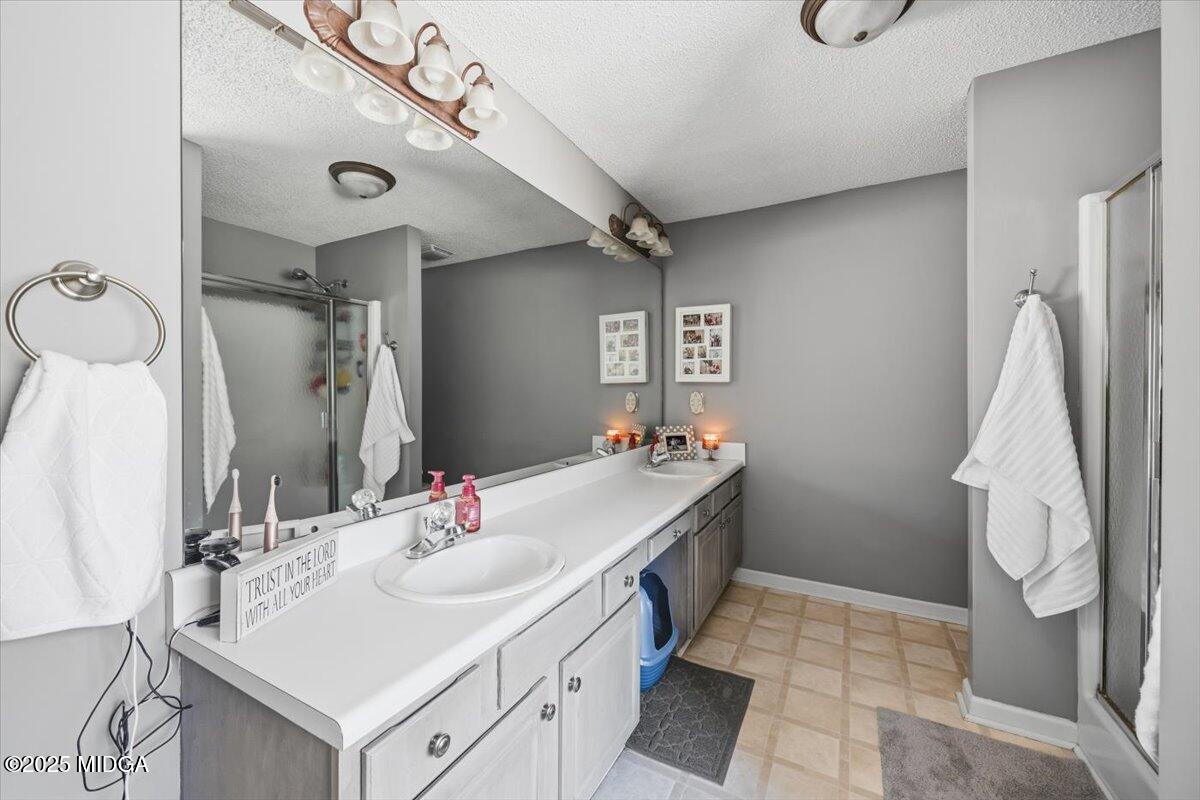 664 Aarons Circle Gray, GA 31032 - Photo 22 of 46 a bathroom with a sink vanity and a mirror