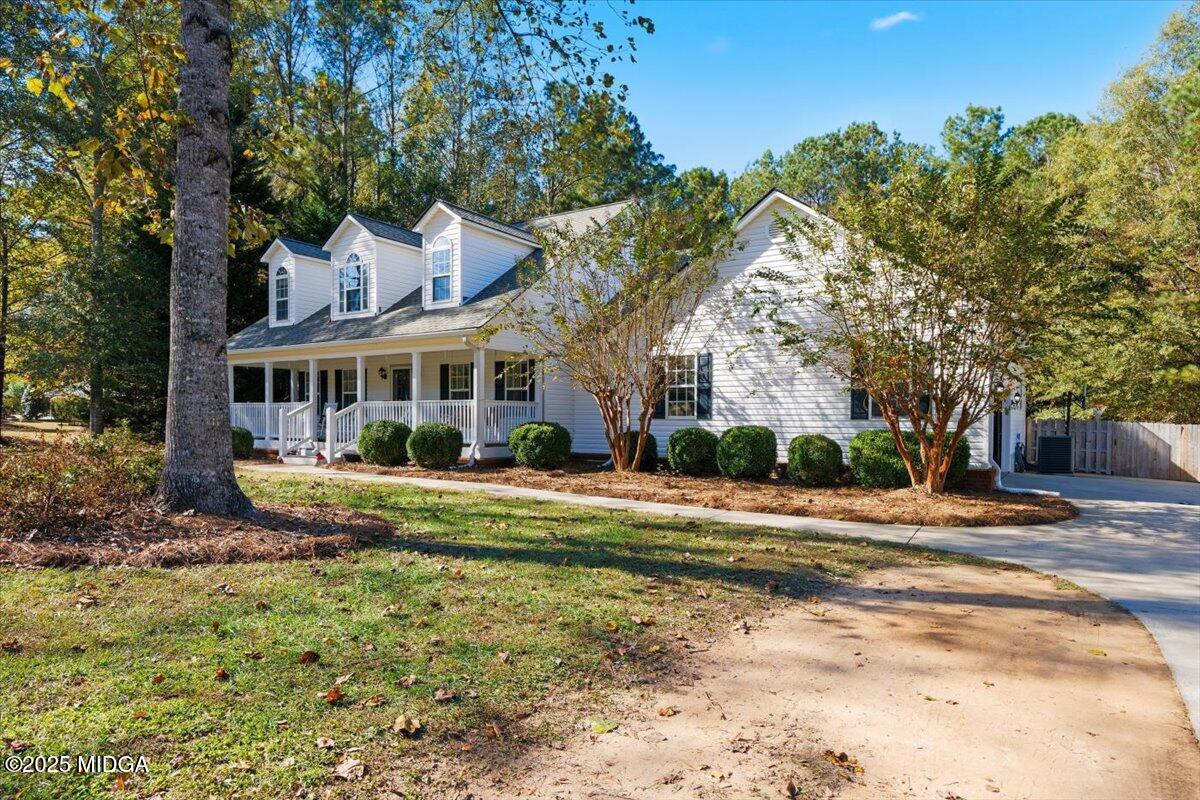 664 Aarons Circle Gray, GA 31032 - Photo 34 of 46 a view of a house with a big yard and large trees