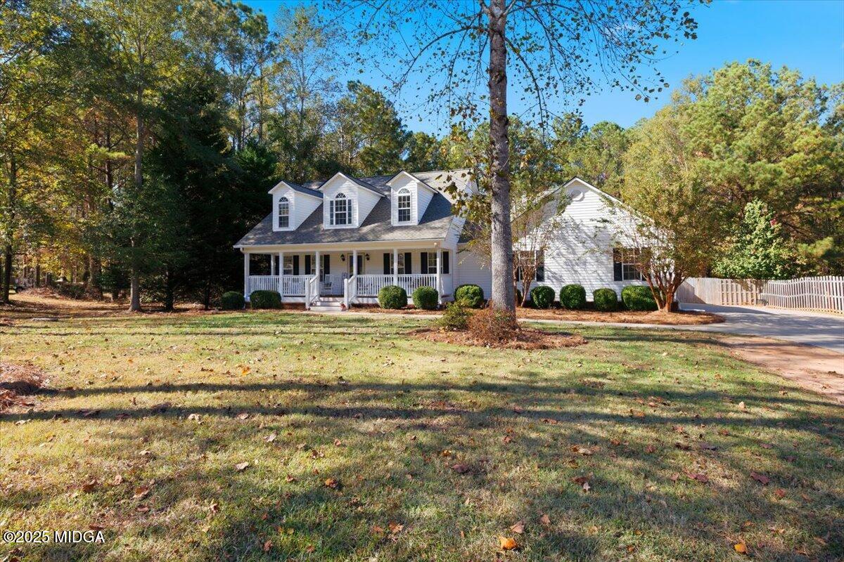 664 Aarons Circle Gray, GA 31032 - Photo 35 of 46 a view of swimming pool with outdoor seating and trees in the background