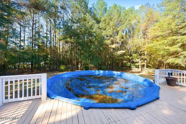 a view of a backyard with table and chairs