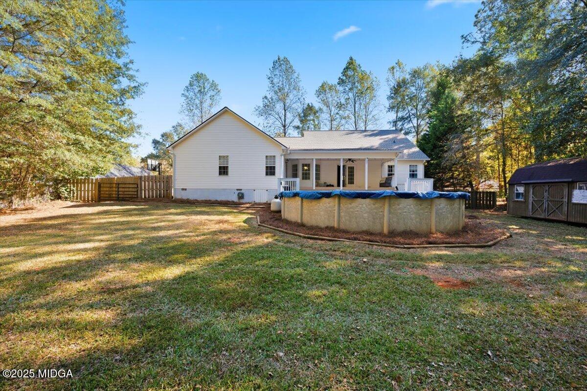 664 Aarons Circle Gray, GA 31032 - Photo 45 of 46 a view of a house with a big yard and large trees