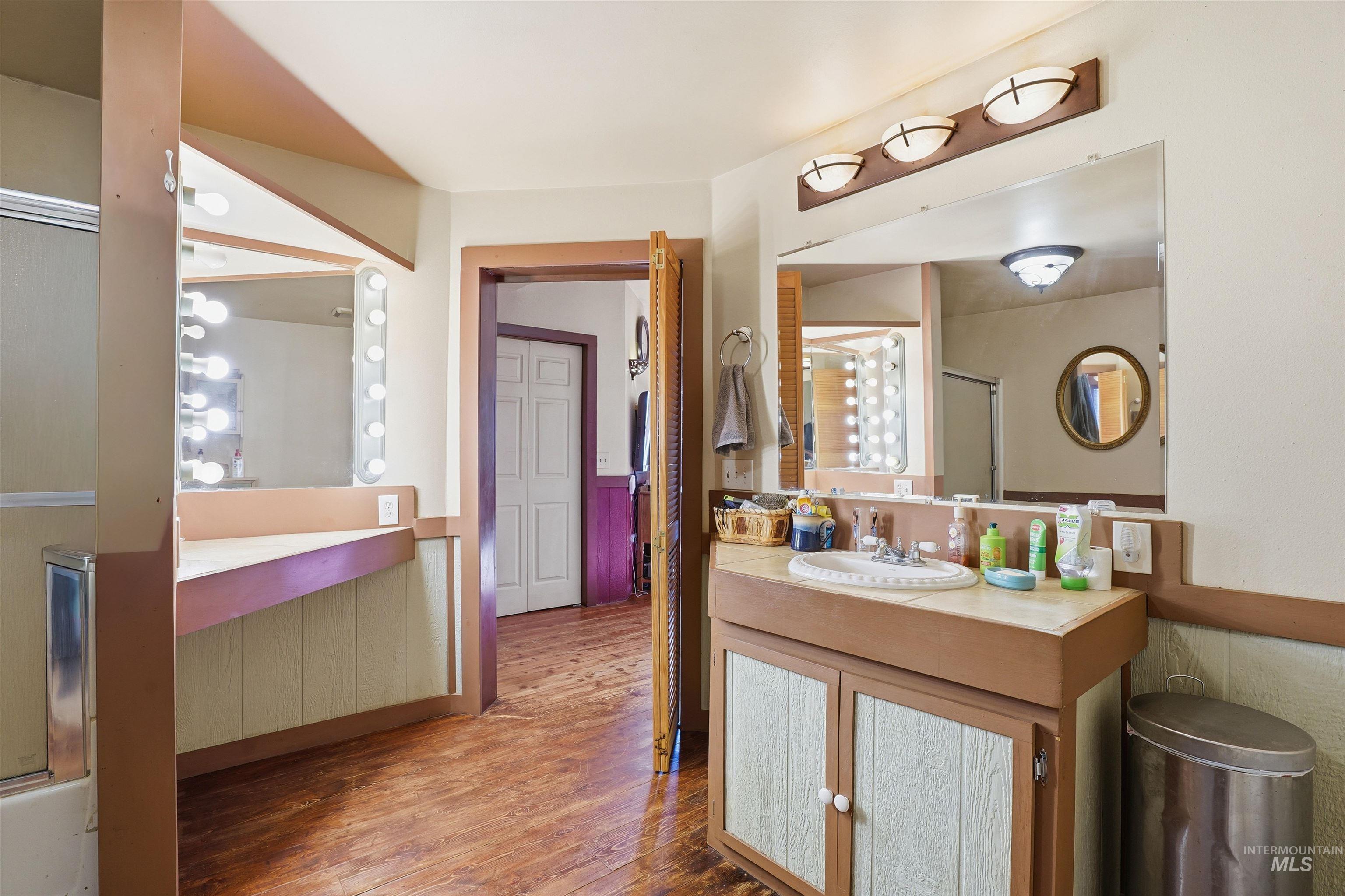1252 Mesa Mesa, ID 83643 - Photo 26 of 50 Full bath featuring a shower stall, vanity, and wood finished floors