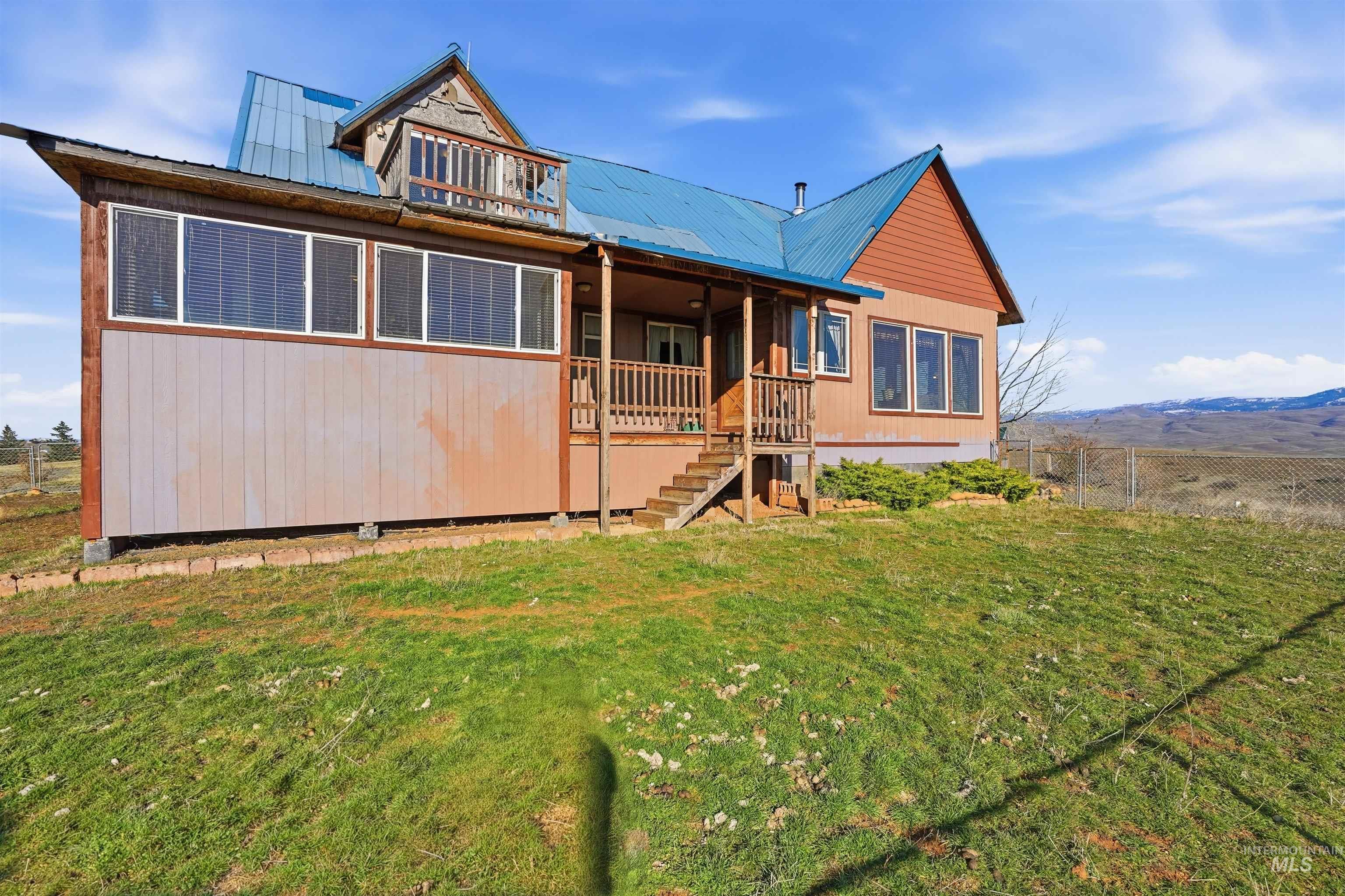 1252 Mesa Mesa, ID 83643 - Photo 33 of 50 View of Back facade featuring a mountain view and a metal roof