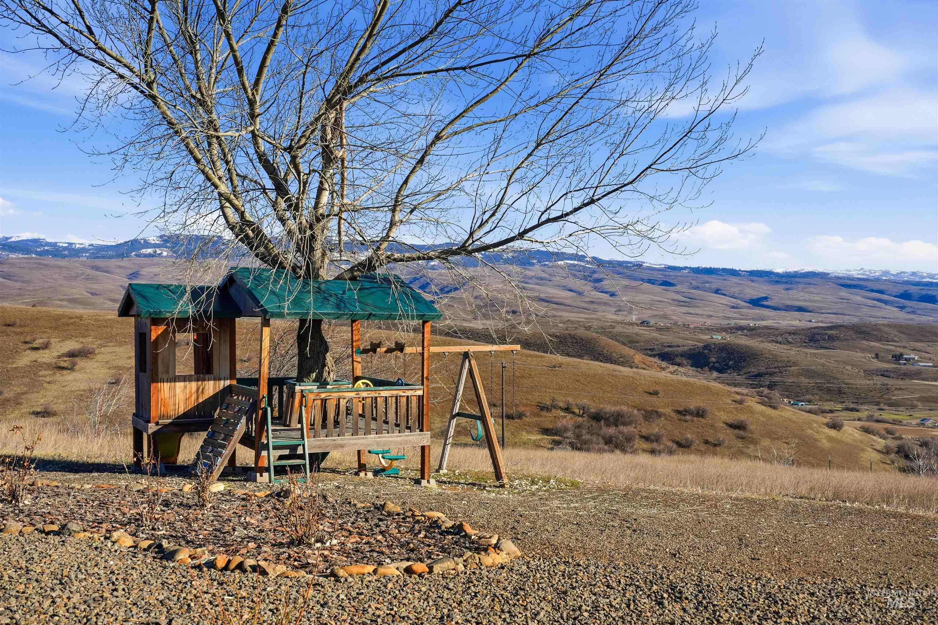 1252 Mesa Mesa, ID 83643 - Photo 38 of 50 View of jungle gym featuring a deck with mountain view