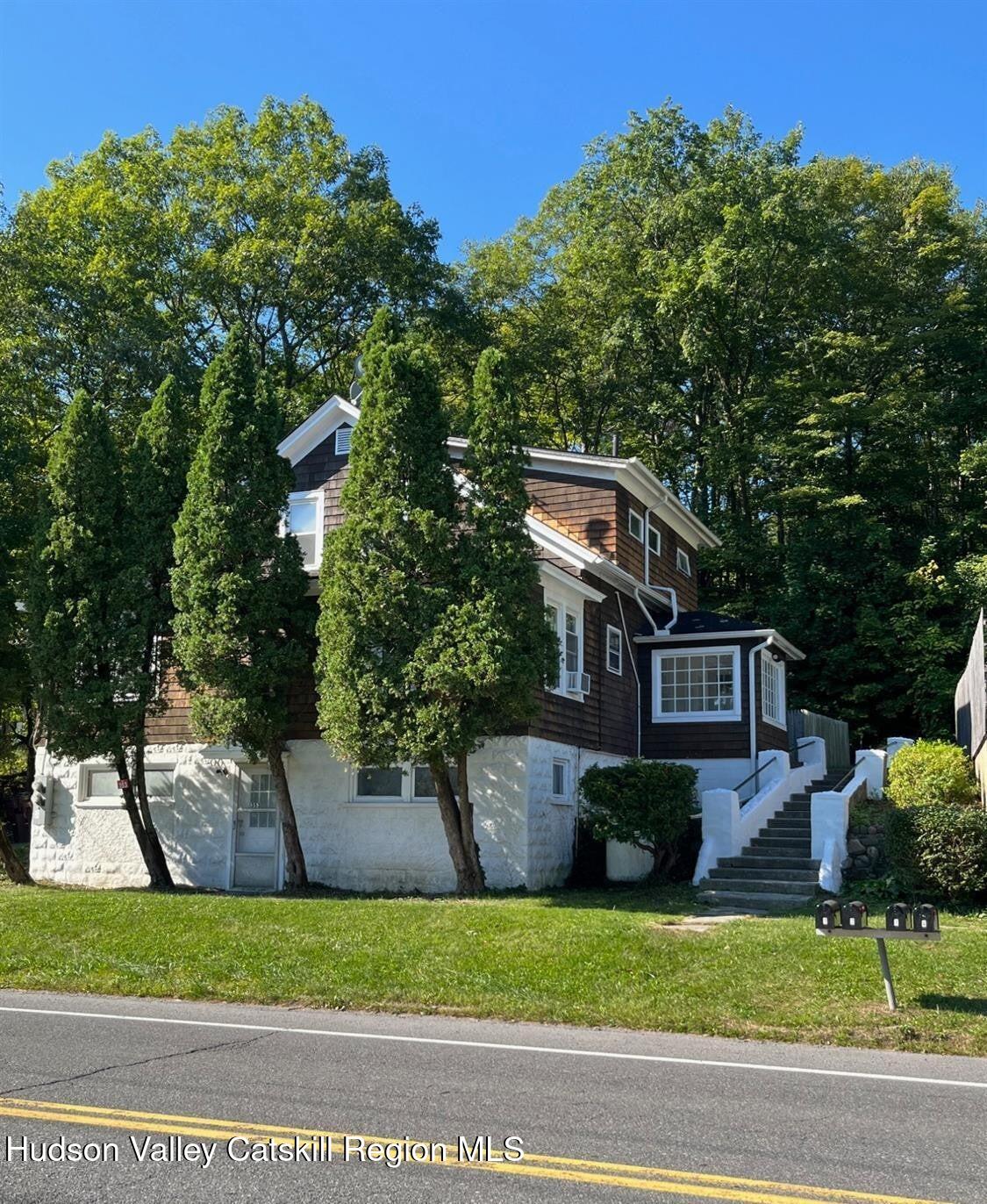 353 Main Street, Unit 2 Cairo, NY 12413 - Photo 1 of 12 a front view of a house with a yard