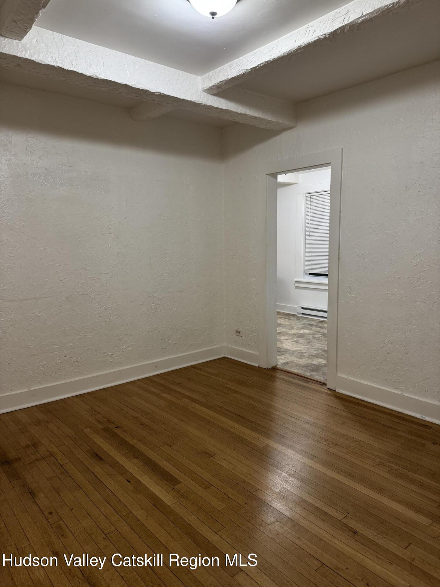 353 Main Street, Unit 2 Cairo, NY 12413 - Photo 12 of 12 a view of an empty room with wooden floor