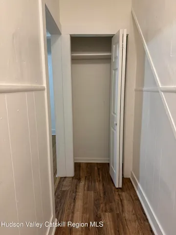 a view of front door with wooden floor