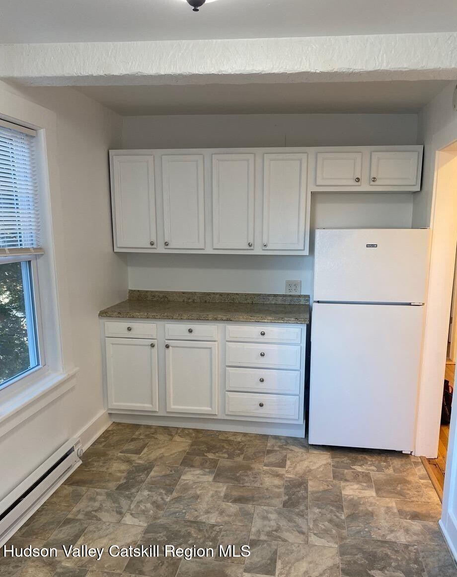 353 Main Street, Unit 2 Cairo, NY 12413 - Photo 6 of 12 a kitchen with cabinets appliances and cabinets
