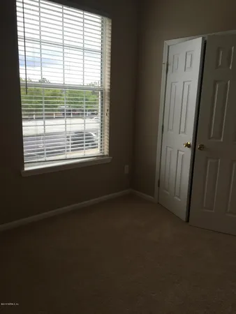 a view of a room that has a window in it