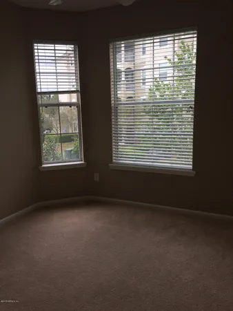 a bathroom with a sink toilet and a mirror