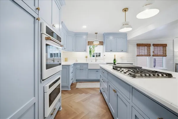 a kitchen with stainless steel appliances granite countertop a stove and a refrigerator