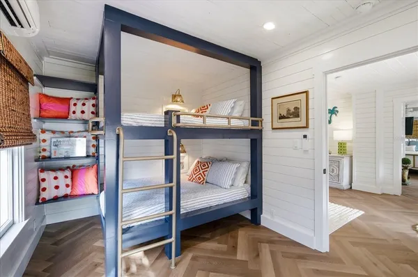a bedroom with furniture and a window