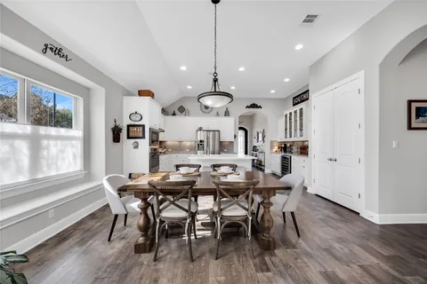 a view of a dining room with furniture window and wooden floor