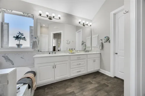 a spacious bathroom with a double vanity sink mirror and