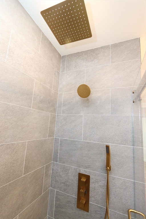 14-16 Harriet Street, Unit 1 Boston, MA 02135 - Photo 12 of 28 a bathroom with a shower