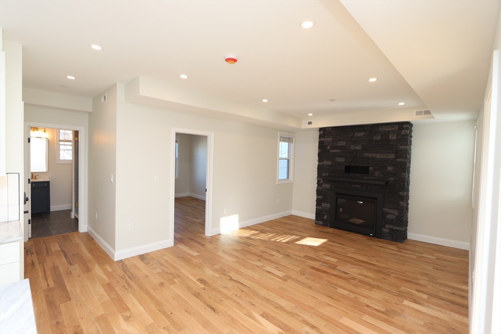 14-16 Harriet Street, Unit 1 Boston, MA 02135 - Photo 6 of 28 a view of an empty room with wooden floor