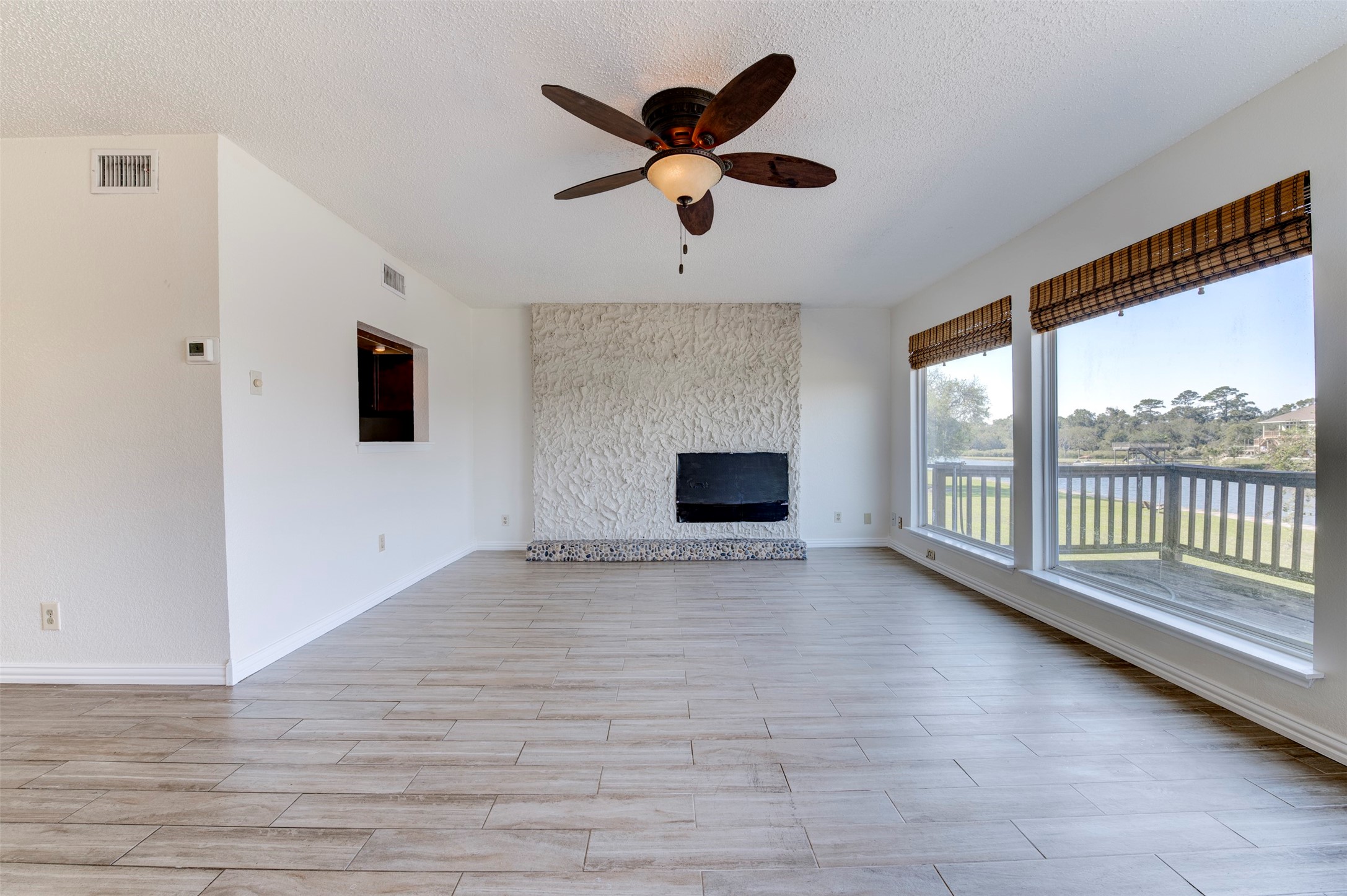 2137 Casa Rio Circle Dickinson, TX 77539 - Photo 14 of 36 Large windows and bayou views fill the room with natural light.