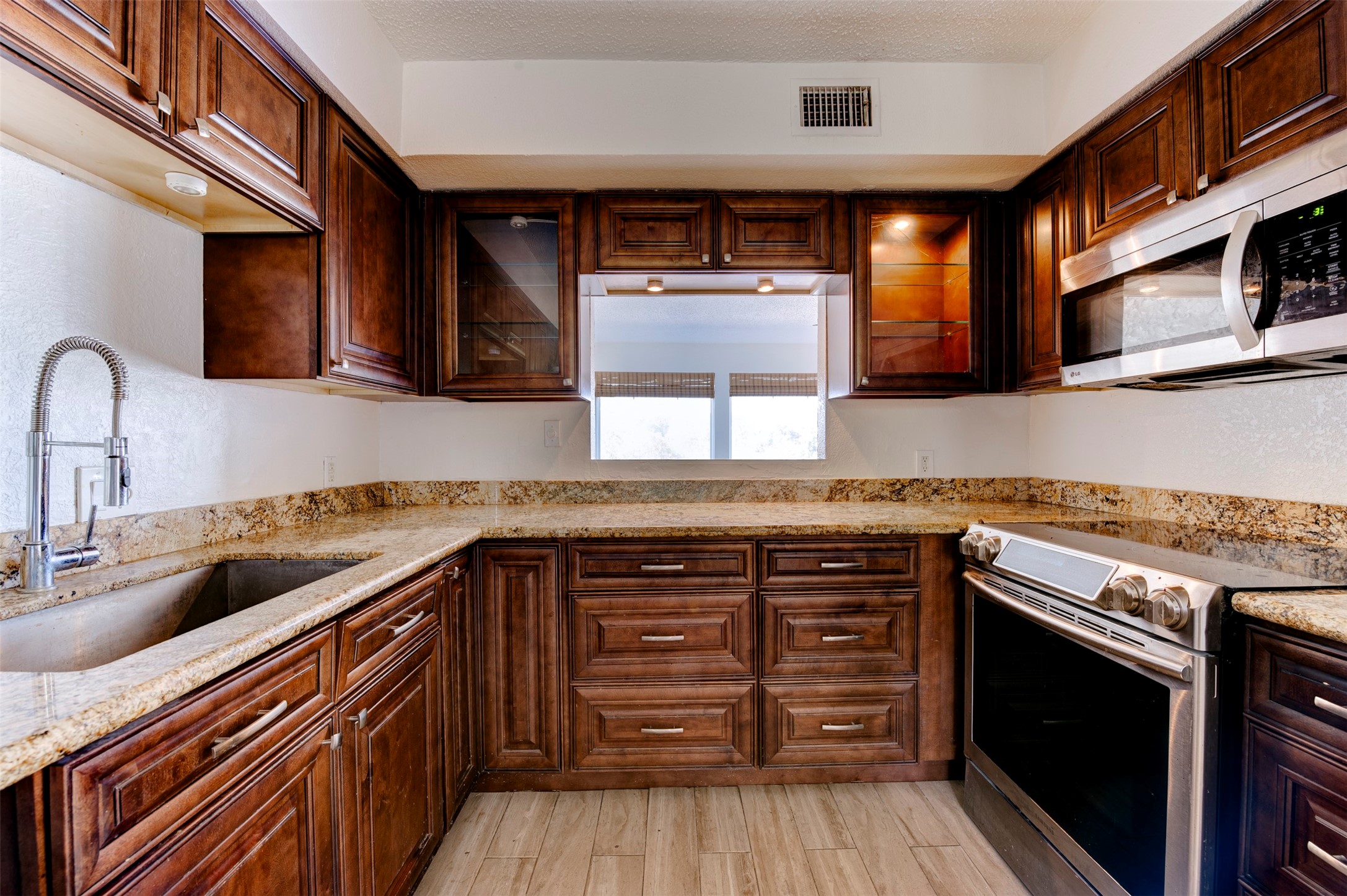 2137 Casa Rio Circle Dickinson, TX 77539 - Photo 19 of 36 Granite countertops and abundant cabinets make this kitchen both stylish and practical
