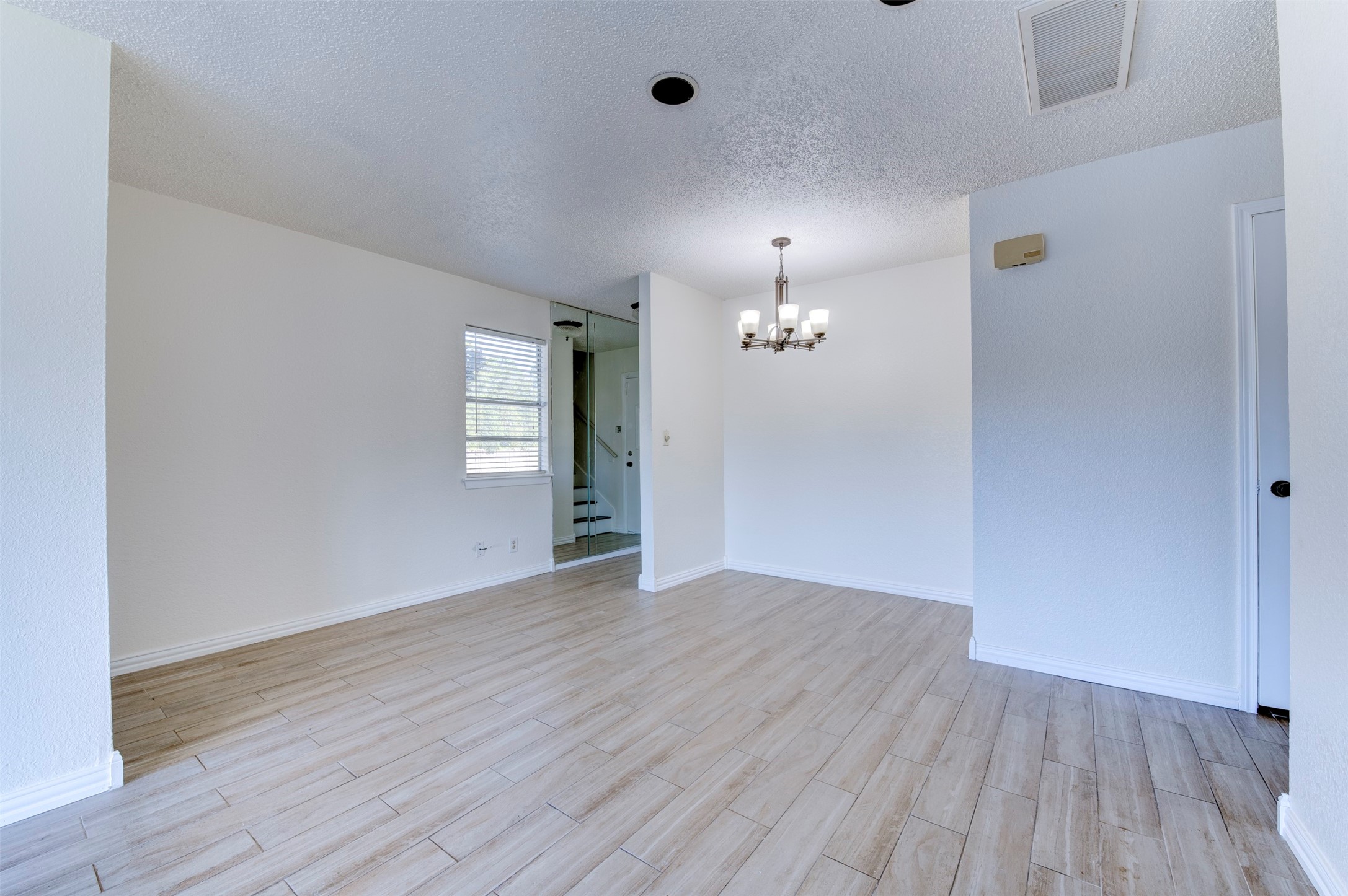2137 Casa Rio Circle Dickinson, TX 77539 - Photo 5 of 36 Easy-care wood-look tile brings a modern touch to the first floor.