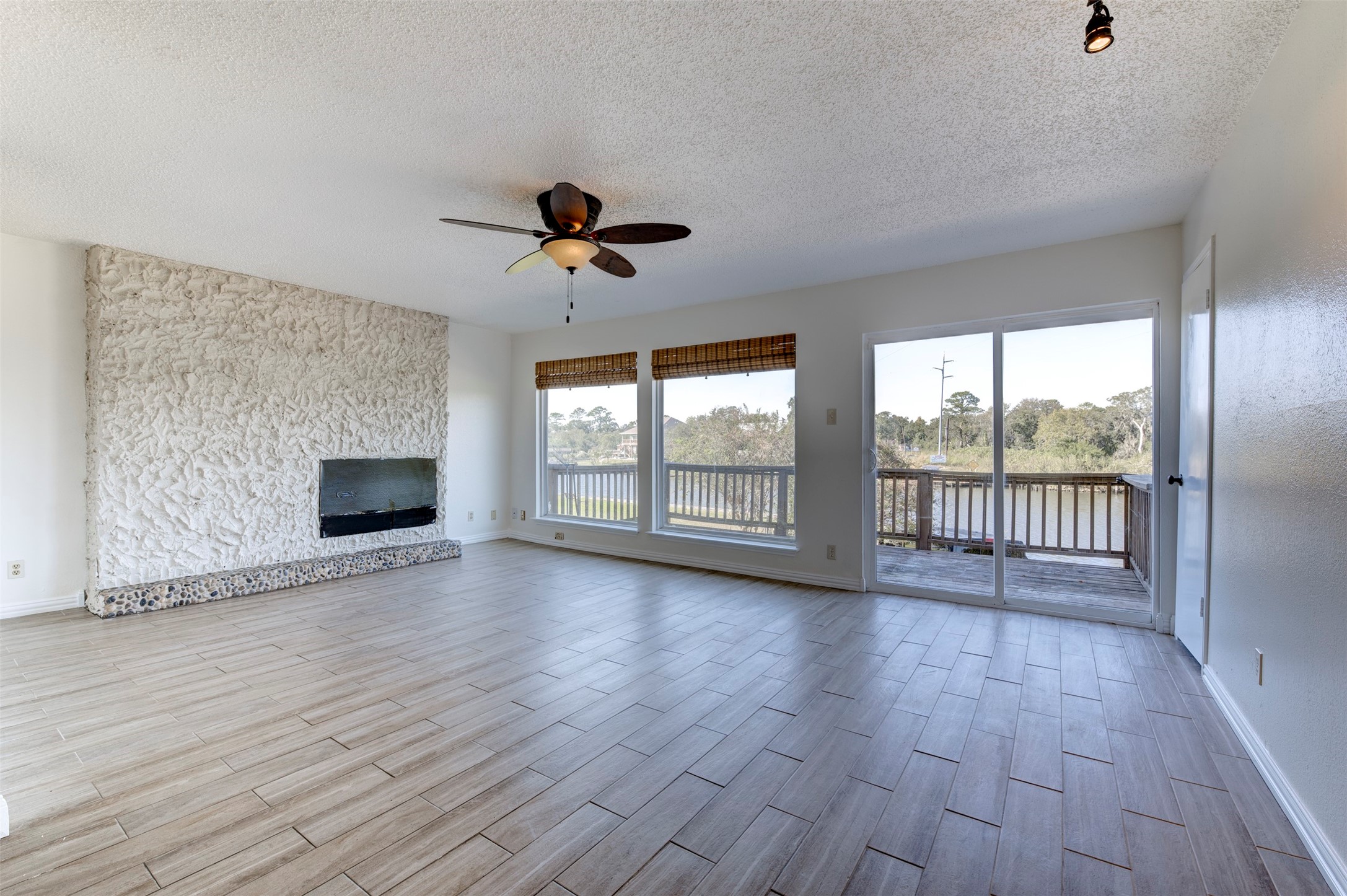 2137 Casa Rio Circle Dickinson, TX 77539 - Photo 10 of 36 Bright and airy spaces with sliding doors to the bayou-view balcony.