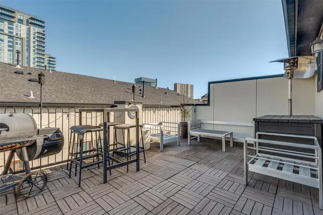 a view of a patio with a table and chairs