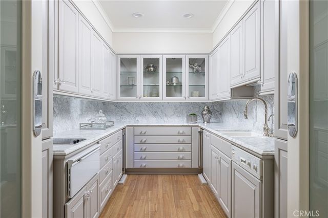 a kitchen with stainless steel appliances granite countertop a stove and a sink
