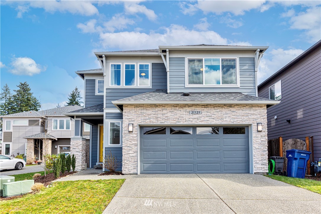 21325 43rd Drive Southeast Bothell, WA 98021 - Photo 1 of 32 a front view of a house with a yard