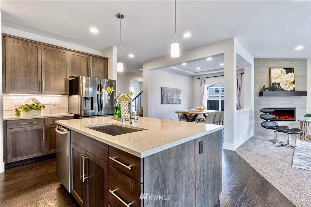 21325 43rd Drive Southeast Bothell, WA 98021 - Photo 15 of 32 a kitchen with a sink stove and cabinets