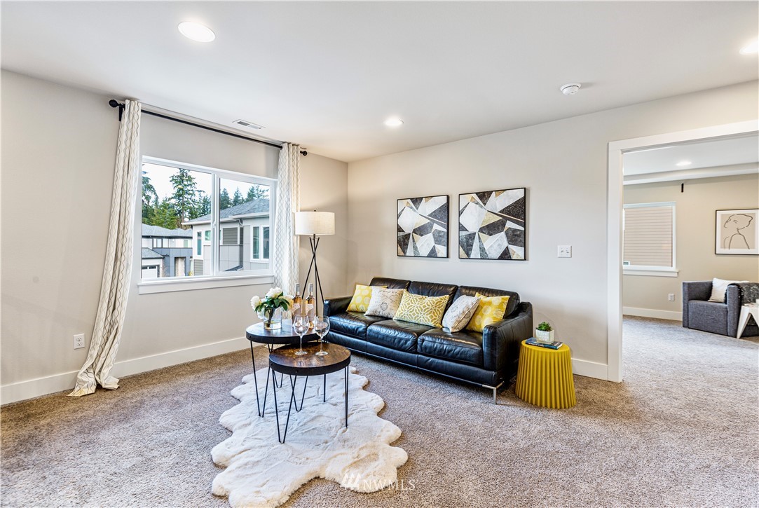 21325 43rd Drive Southeast Bothell, WA 98021 - Photo 20 of 32 a living room with furniture and a large window