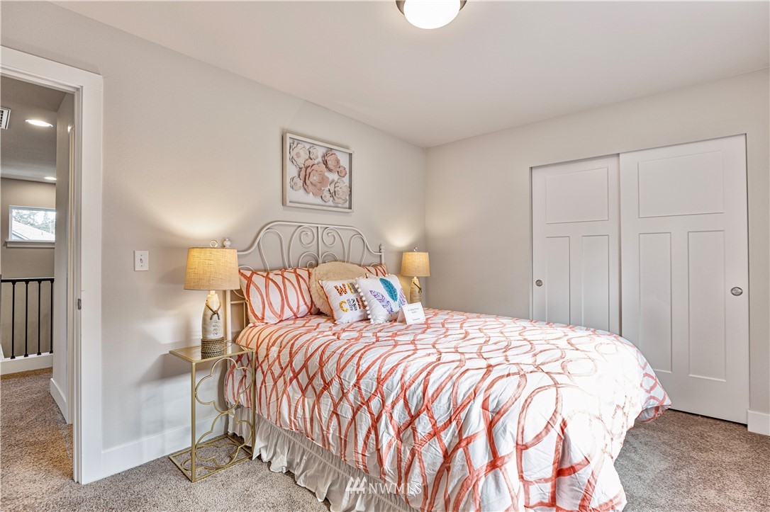 21325 43rd Drive Southeast Bothell, WA 98021 - Photo 26 of 32 a bedroom with a bed and painting on the wall